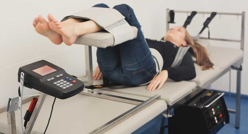 patient receiving spinal decompression in Sacramento for Osteoarthritis relief